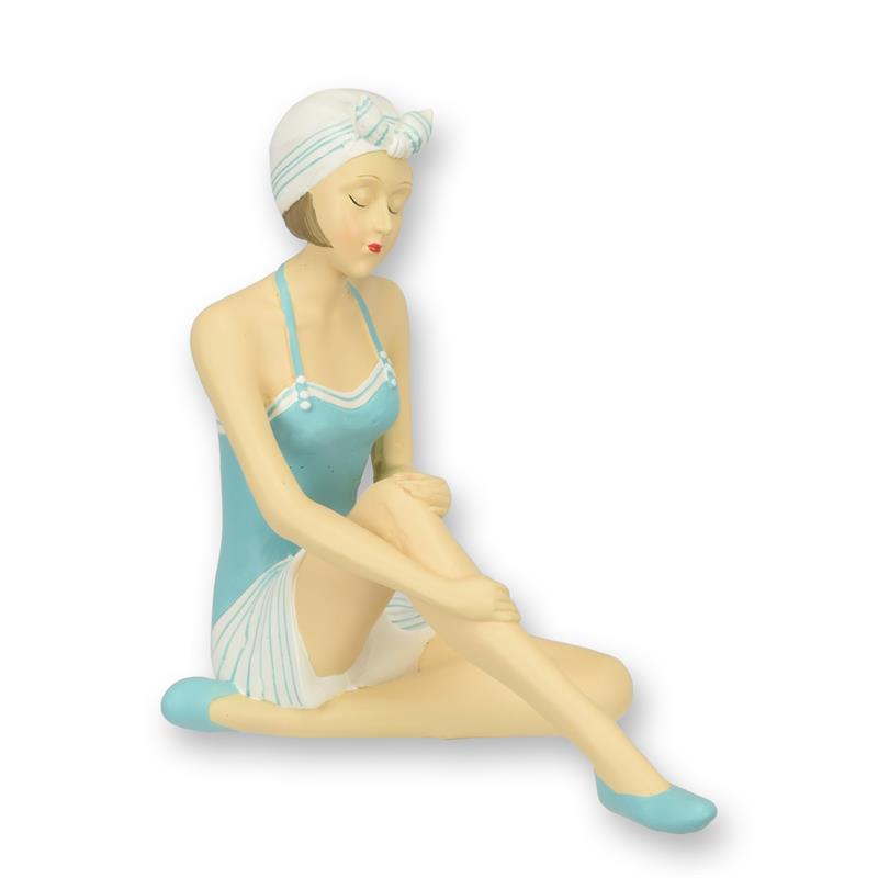 A\u0020RESIN\u0020FIGURINE\u0020OF\u0020A\u0020RETRO\u0020BEACH\u0020GIRL