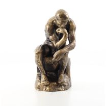 A CAST IRON SCULPTURE OF THE THINKER