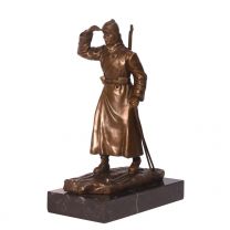 A BRONZE SCULPTURE OF A RUSSIAN SOLDIER ON SKIES