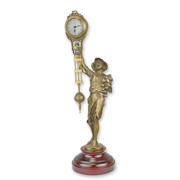 A TABLE CLOCK MYSTERIEUSE HELT BY A BOY