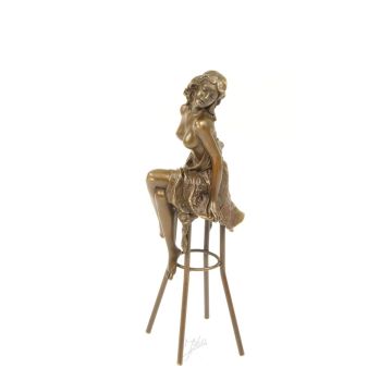 A BRONZE SCULPTURE OF A LADY ON BARCHAIR