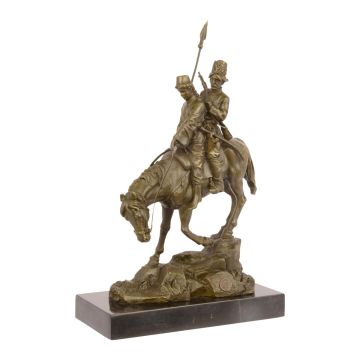 A BRONZE SCULPTURE CALLED DOWNHILL RIDE