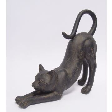 A RESIN FIGURINE OF A STRETCHING CAT