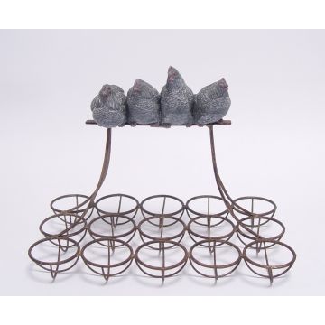 AN IRON EGG RACK MOUNTED WITH RESIN HENS