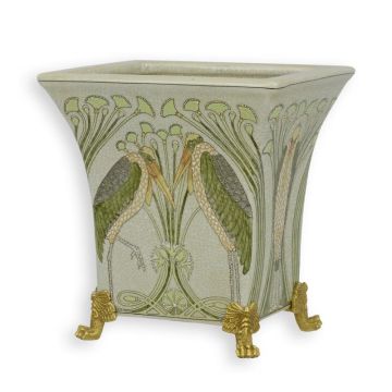 A BRONZE MOUNTED PORCELAIN PLANTER