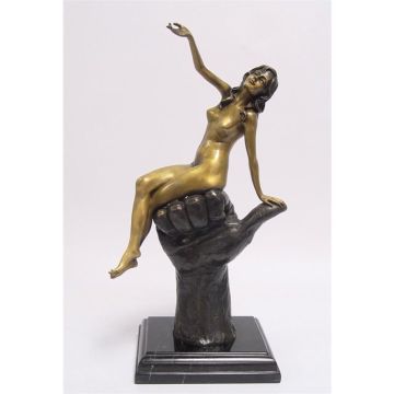 A BRONZE SCULPTURE OF A FEMALE NUDE SITTING ON A HAND