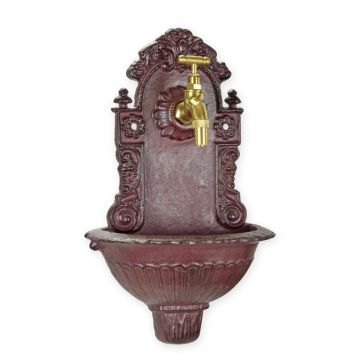 A CAST IRON WALL FOUNTAIN