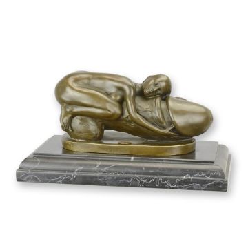A BRONZE SCULPTURE OF A WOMAN EMBRACING A PHALLUS