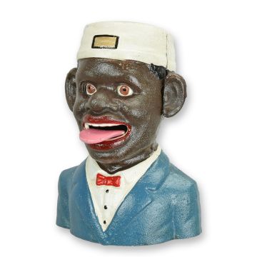A CAST IRON BLACK MAN MECHANICAL BANK
