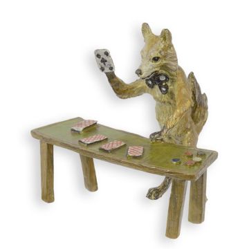A BRONZE SCULPTURE OF A FOX PLAYING CARDS