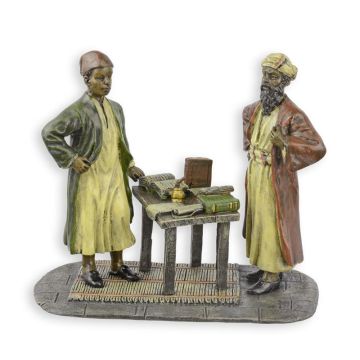 A BRONZE SCULPTURE OF TWO ARAB SCRIBES