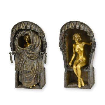 A BRONZE SCULPTURE OF A FEMALE NUD EIN BEACH CHAIR