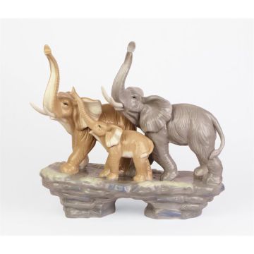 A PORCELAIN GROUP OF AN ELEPHANT FAMILY