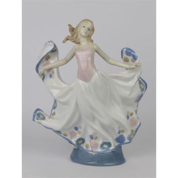 A PORCELAIN FIGURINE OF A DANCER