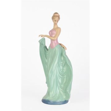 A PORCELAIN FIGURINE OF A DANCER