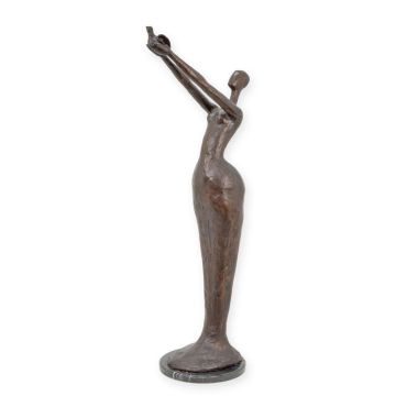 A MODERNIST BRONZE SCULPTURE OF A WOMAN RELEASING A BIRD