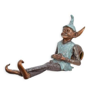 A BRONZE SCULPTURE OF A GOBLIN LEANING AGAINST A JAR