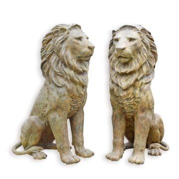 A BRONZE SCULPTURE OF A SITTING LION