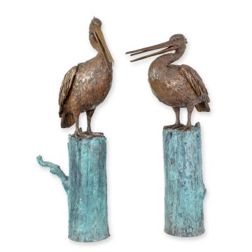 A BRONZE PAIR OF PELICANS ON A LOG FOUNTAINS