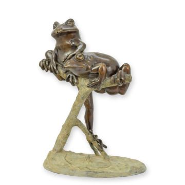 A BRONZE FOUNTAIN WITH TWO FROGS ON A BRANCH