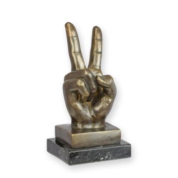 A BRONZE SCULPTURE OF A PIECE SIGN HAND