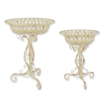 A PAIR OF IRON PLANTERS ON STAND