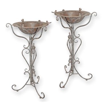A PAIR OF IRON BIRD BATHS