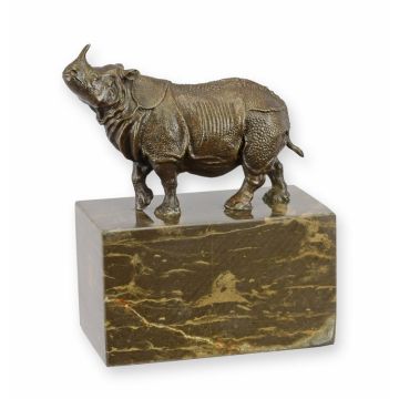 A BRONZE SCULPTURE OF A RHINOCEROS
