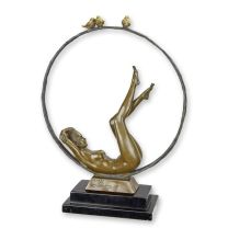 A BRONZE SCULPTURE OF A FEMALE NUDE WITH HOOP