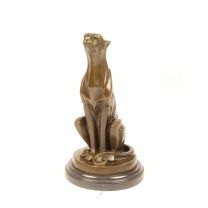 A BRONZE SCULPTURE OF A SITTING CHEETAH