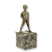 A BRONZE SCULPTURE OF A SKIER BOY
