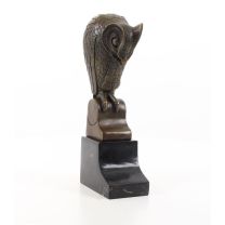 A BRONZE SCULPTURE OF AN OWL