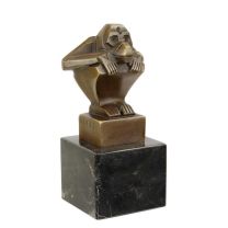 A BRONZE SCULPTURE OF A SQUATTING MONKEY