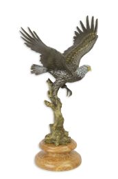A BRONZE SCULPTURE OF AN EAGLE IN A FLIGHT