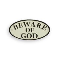A CAST IRON "BEWARE OF GOD" PLAQUE