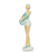 A RESIN FIGURINE OF A RETRO BEACH GIRL