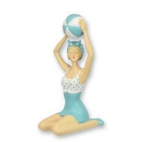 A RESIN FIGURINE OF A RETRO BEACH GIRL