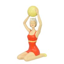 A RESIN FIGURINE OF A RETRO BEACH GIRL