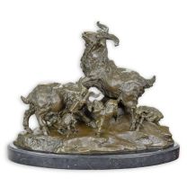 A BRONZE GROUP OF A FAMILY OF GOATS