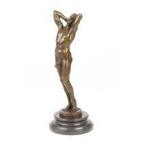 A BRONZE SCULPTURE OF A MALE NUDE