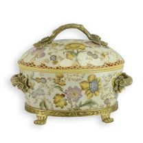 A BRASS MOUNTED PORCELAIN BOX AND COVER