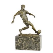 A BRONZE SCULPTURE OF A SOCCER PLAYER