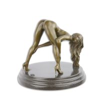 AN EROTIC BRONZE SCULPTURE OF A FEMALE NUDE BENDING OVER