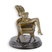 AN EROTIC BRONZE SCULPTURE OF A SEATED FEMALE NUDE