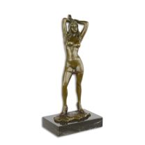AN EROTIC BRONZE SCULPTURE OF A FEMALE NUDE
