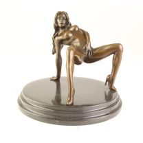 AN EROTIC BRONZE SCULPTURE OF A FEMALE NUDE