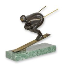 A BRONZE SCULPTURE OF A SKIER