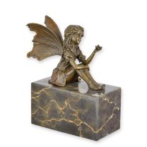 A BRONZE SCULPTURE OF A FAIRY HOLDING A BUTTERFLY