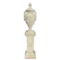 A CAST IRON URN ON A BASE, WHITE