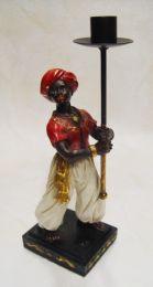 A RESIN VASSAL CANDLE HOLDER